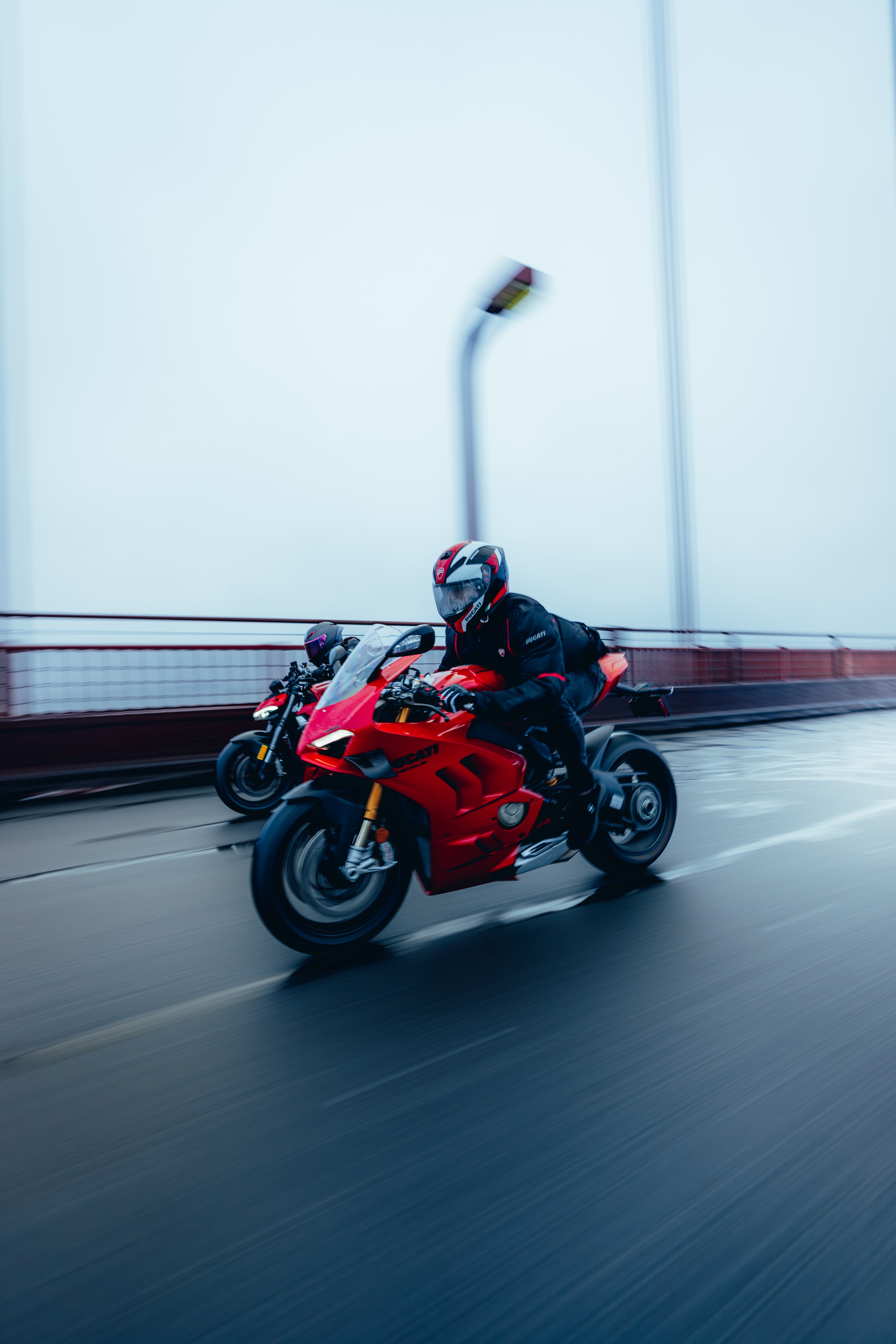 Ducati Panigale V4S rider, helmet and tank detail at speed