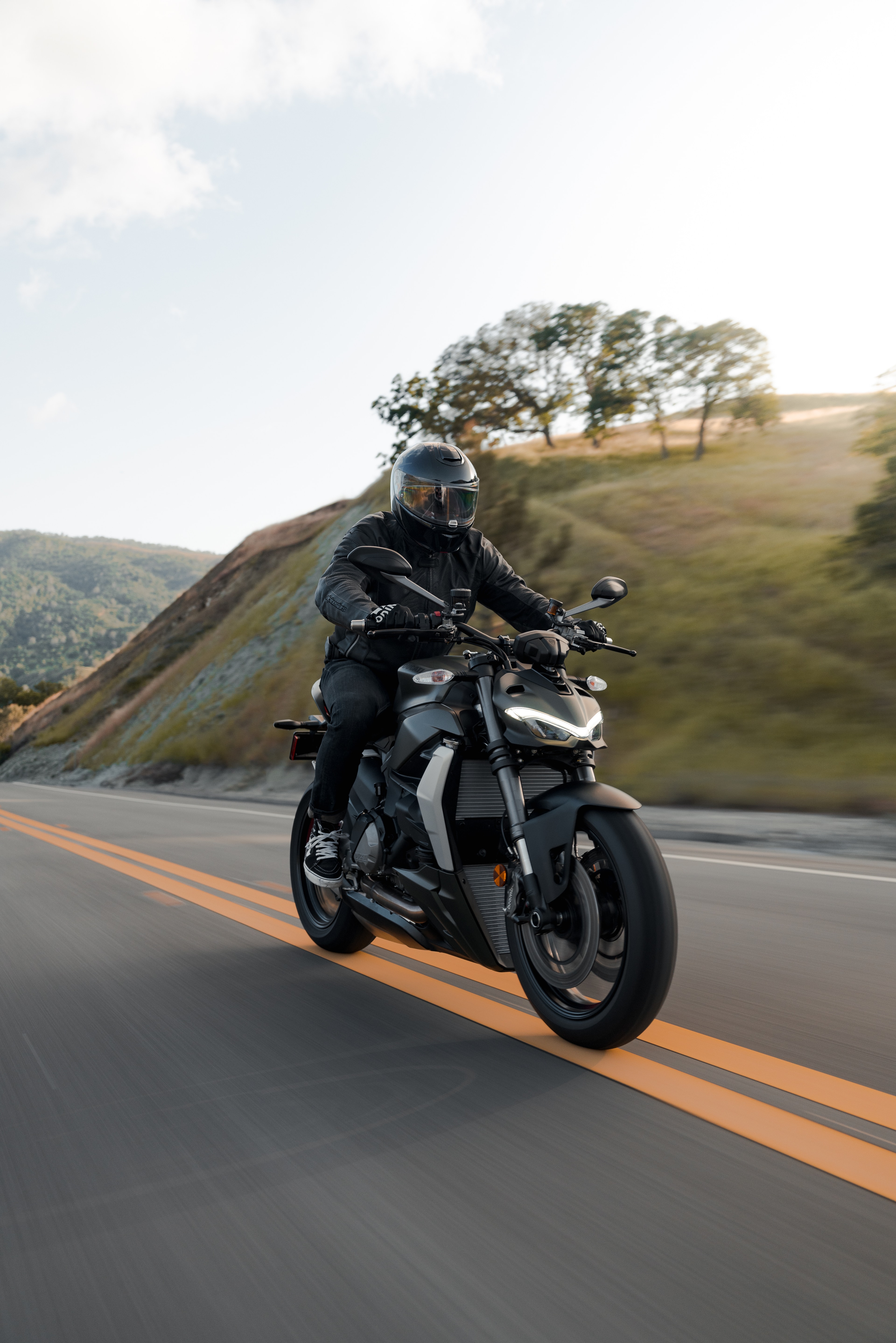 Ducati Street Fighter in motion, golden hour, California hills